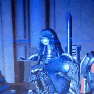 a statue of a robot with a blue light on it
