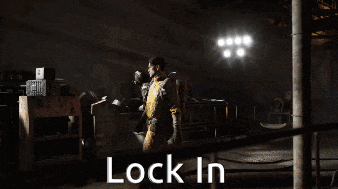a man in a yellow jacket is sitting in a car with the words lock in below him