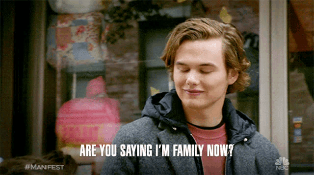 a man says " are you saying i 'm family now " in front of a store window