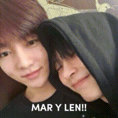 a couple of people are posing for a picture and one of them is wearing a hooded jacket and says mary len