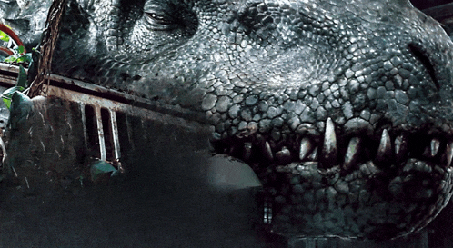 a close up of a dinosaur 's head with a jeep in the background