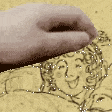 a close up of a hand holding a drawing of a woman 's face .