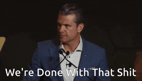 a man in a suit is giving a speech with the words we 're done with that shit behind him