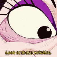 a close up of a cartoon character 's eyes with the words `` look at these wrinkles '' .