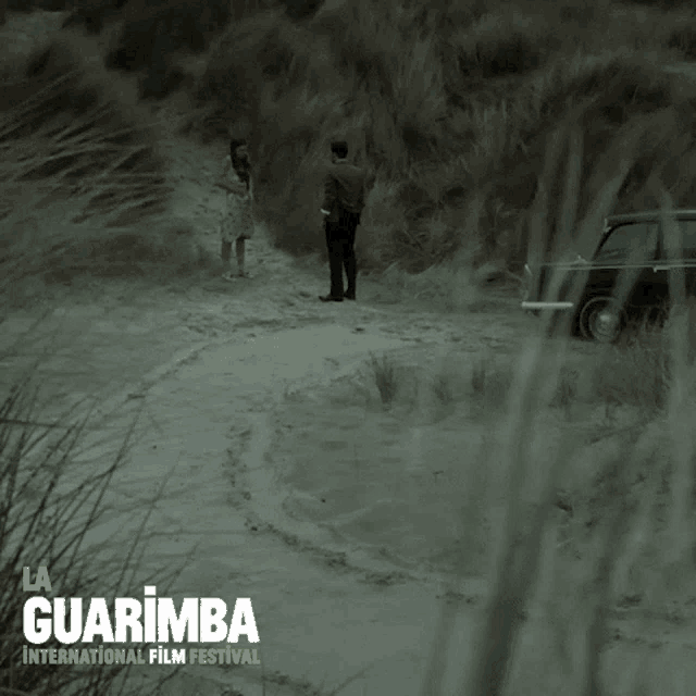 a poster for la guarimba international film festival shows a man and a woman