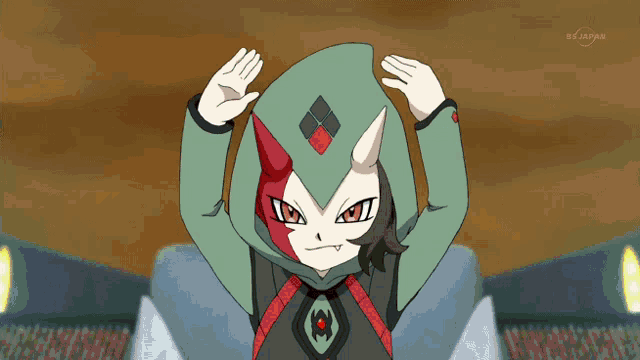 a cartoon character with a green hood and red and white horns is on a tv screen