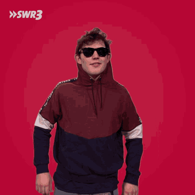 a man wearing sunglasses and a hoodie with swr3 on the bottom right