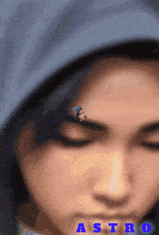 a close up of a person 's face with the word astro on the bottom right