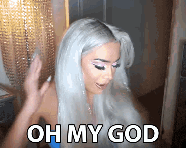 a woman with white hair says oh my god in white letters