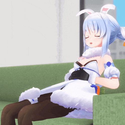 a cartoon character is sitting on a green couch with her eyes closed