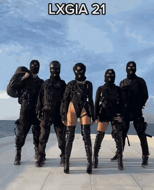 a group of people wearing ski masks standing next to each other with the words lxgia 21 on the top