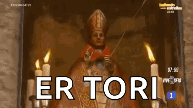 a statue of a bishop is surrounded by candles and the words " er tori " on the bottom