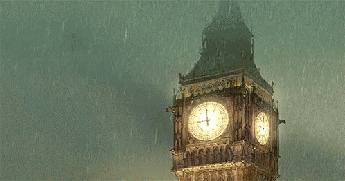 the big ben clock tower is lit up in the rain and shows the time as 1:15