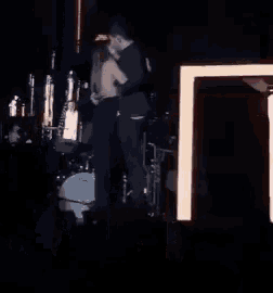 a man and a woman are hugging on a stage .