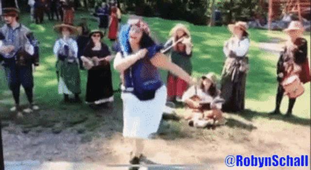 a group of people are gathered in a park with the name robyn schall at the top