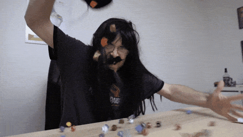 a man with long hair and a mustache wearing a shirt that says ' phoenix ' on it