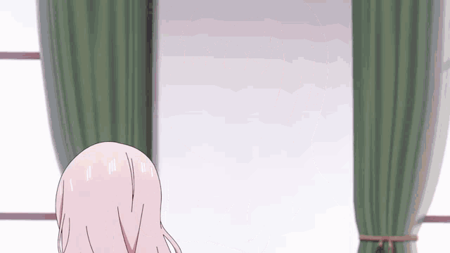 a girl with pink hair is looking out a window with green curtains .