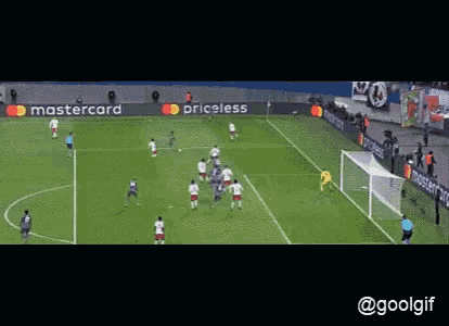 a soccer game is being played on a field with a mastercard advertisement behind it