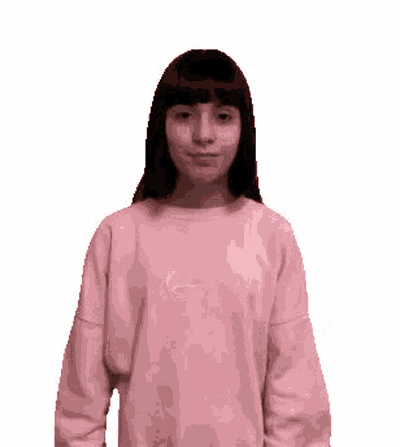 a woman wearing a pink sweater is making a funny face .