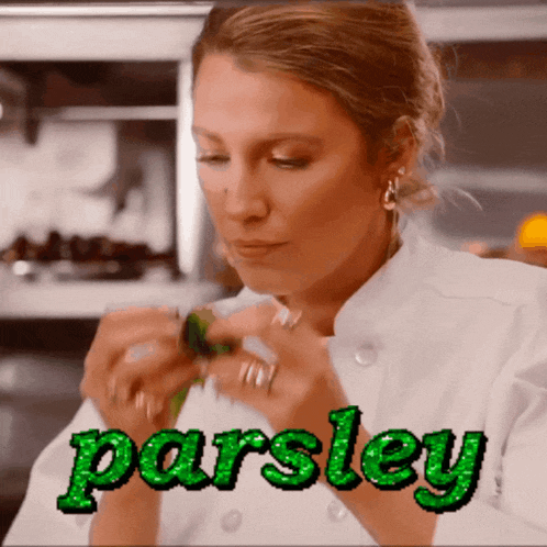 a woman in a chef 's uniform is cooking and the name parsley is visible
