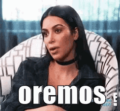 a woman is sitting in a chair with the words oremos written on the bottom