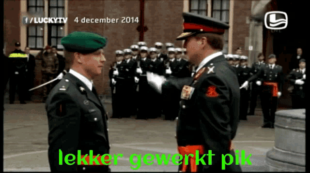 two men in military uniforms are standing next to each other with lucky tv written on the bottom