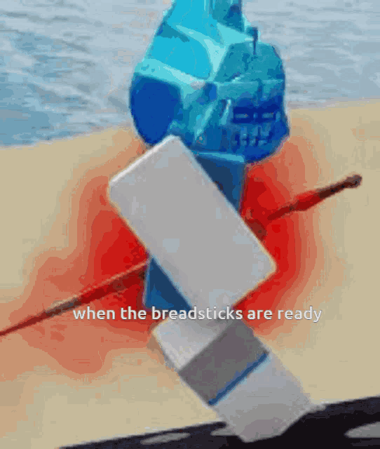 a blue ice cream cone with a white shield and a red sword says when the breadsticks are ready