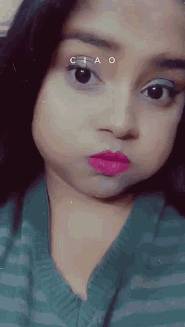 a close up of a woman 's face with the word ciao on her face