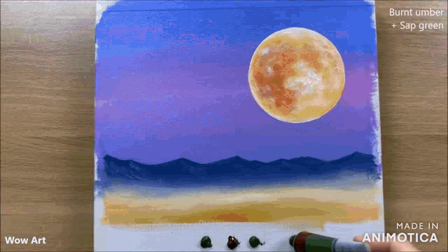 a painting of a full moon is being painted on a canvas by wow art
