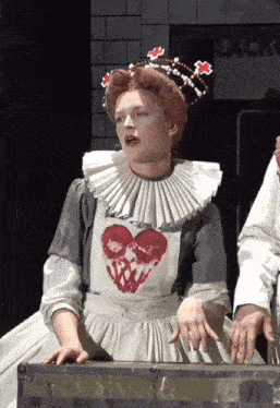 a woman in an apron with a heart on it
