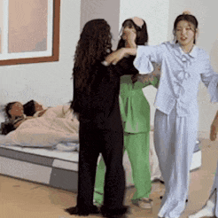 a group of women are standing next to each other in a room .