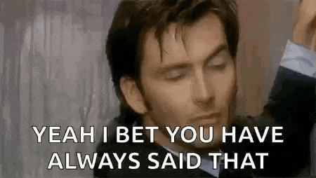 a man in a suit is making a funny face and says `` yeah i bet you have always said that '' .
