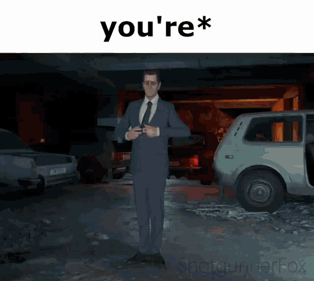 a man in a suit and tie is standing in a parking garage with the words you 're *