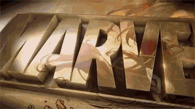 the word marvel is written in gold letters on a black background