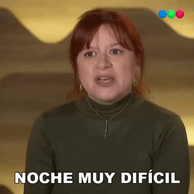 a woman with red hair says noche muy dificil in a foreign language