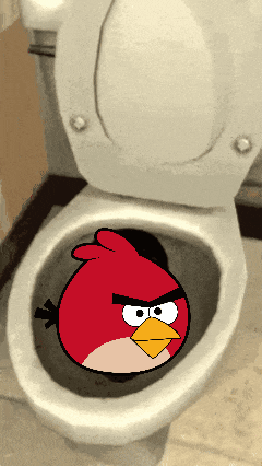 a red angry bird sits on a toilet