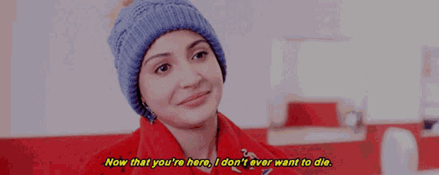 a woman wearing a blue hat says now that you 're here i don 't ever want to die ..