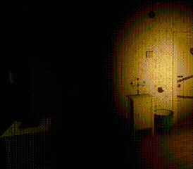 a person is standing in a dark room with a candle on a nightstand .