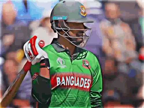 a man wearing a helmet and a green shirt that says ' bangladesh ' on it