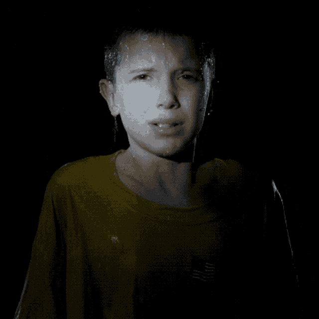 a young boy with water coming out of his nose