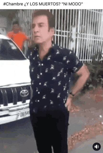 a man standing in front of a white jeep with a license plate that says f08-54