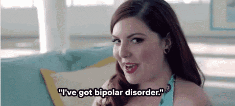 a woman is sitting on a couch talking about having bipolar disorder .