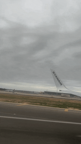 a ryanair plane is sitting on the runway
