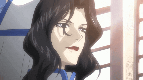 a close up of a woman 's face with dark hair