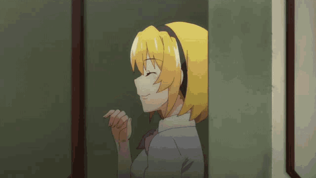 a girl with yellow hair is standing in a doorway with her eyes closed