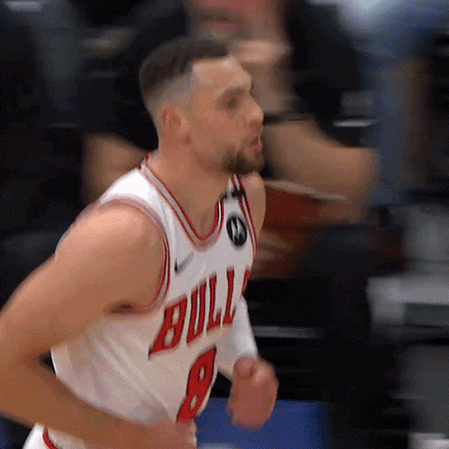 a basketball player wearing a bulls jersey number 8