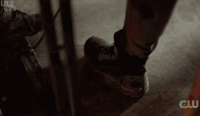 a man is laying on a table with candles and a bottle of alcohol and the words lulu gifs on the bottom