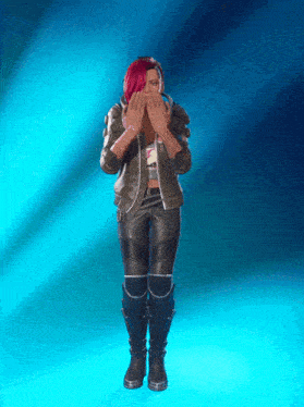 a woman with red hair covering her face with her hands on a blue background