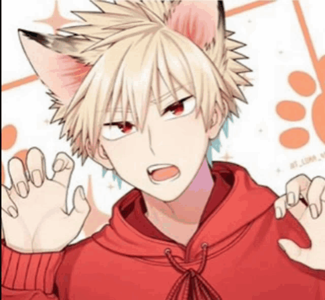 a boy with cat ears is wearing a red hoodie and waving his hand .