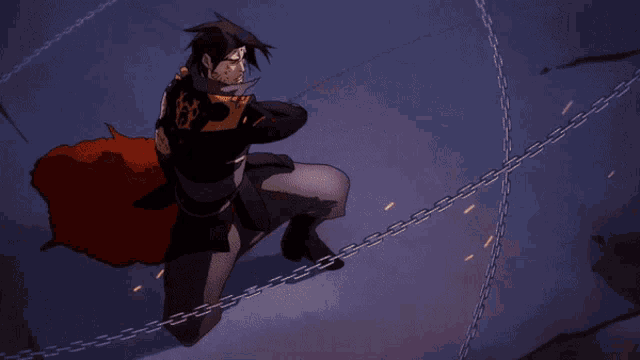 a man in a cape is chained to a wall